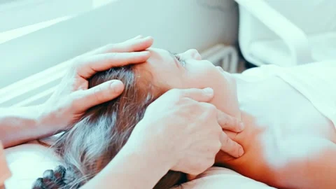 Real doctor osteopath hands does physiological and emotional therapy for kid Stock Footage 158287521