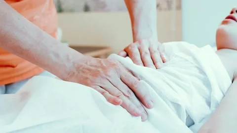 Real doctor osteopath hands does physiological and emotional therapy for kid Stock Footage 158288174