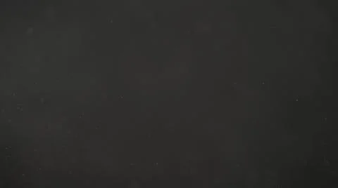 Real dust particles in air with back light over black background Stock Photos