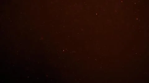 Real dust particles in air with back light over black background Stock Photos