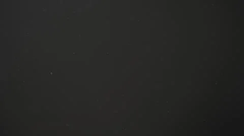 Real dust particles in air with back light over black background Stock Photos
