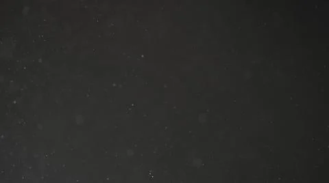 Real dust particles in air with back light over black background Stock Photos