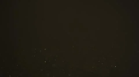 Real dust particles in air with back light over black background Stock Photos