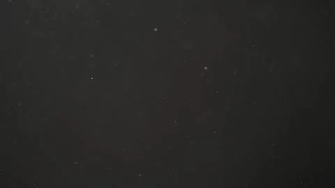 Real dust particles in air with back light over black background Stock Photos