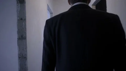 Real estate agent and client walk through the rooms of the apartment Stock Footage 81823626