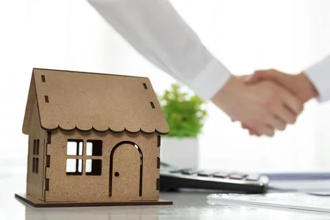  Real estate agent and client handshake.  Stock Photos