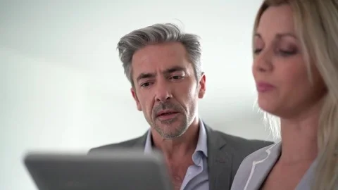 Real-estate agent with client visiting modern house Stock-Footage 74181747