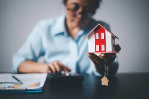 Real estate agent delivering sample homes to customers, mortgage loan contr.. Stock Photos
