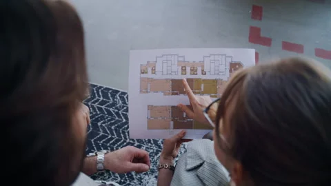 Real Estate Agent Explains Flat Layout to Potential Buyers Stock Footage 311821058