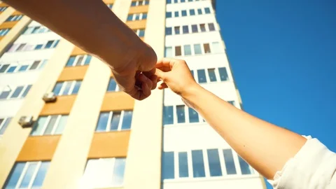 Real estate agent holding house key to his client after signing contract Stock Footage 111663406