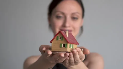 Real estate agent with house model Stock Footage 333069541