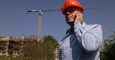 Real Estate Agent Man Talking Phone Residential Apartments Building Construction Stock Footage 50040272