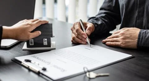 Real estate agent or sales manager has proposed terms and conditions to custo Stock Photos