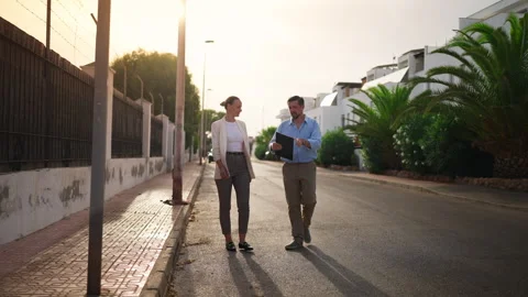 Real estate agent show potential home to female client while walk through s.. Stock Footage 340468629