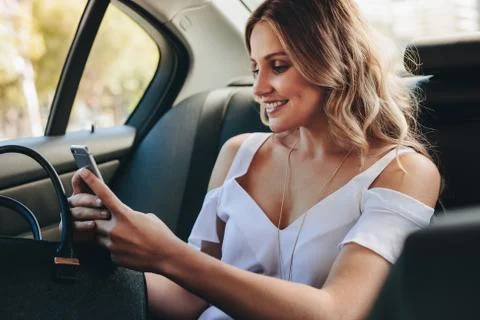Real estate agent texting client during commute Stock Photos