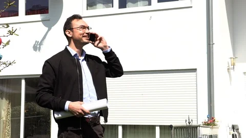 A real estate agent is waiting for a client Stock Footage 107719210