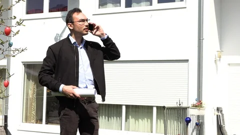 A real estate agent is waiting for a client Stock Footage 107719458
