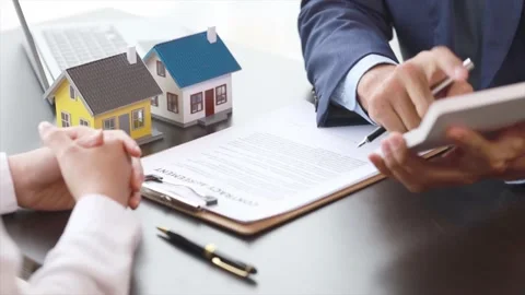 Real estate agents explain models Stock Footage 217506635