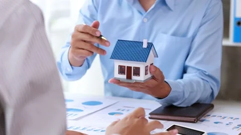 Real estate agents explain models Stock Footage 217507229