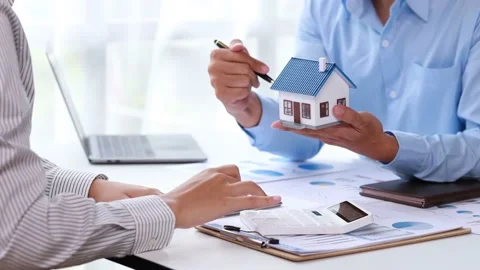 Real estate agents explain models Stock Footage 217507232