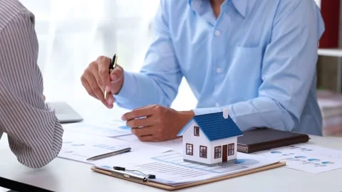 Real estate agents explain models Stock Footage 217507408