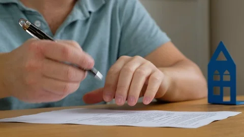 Real estate broker and customer signing a contract: real estate, home loan Stock Footage 123770816