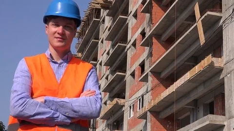 Real estate builder investor with hardhat portrait arms folded smiling confident Stock Footage