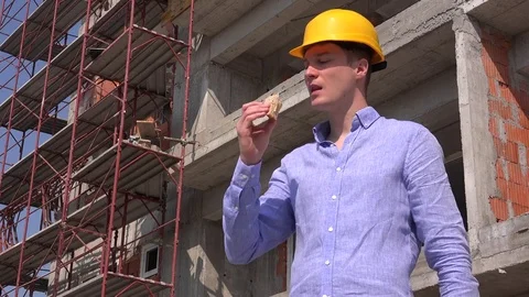 Real estate builder investor having lunch break outdoor home construction worker Stock Footage