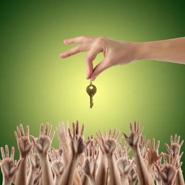 REAL ESTATE concept. Many hands want to get the key, reaching ou Stock Photos