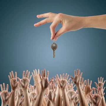 REAL ESTATE concept. Many hands want to get the key, reaching ou Stock Photos