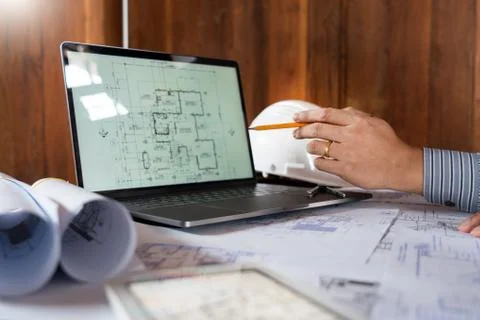 Real-estate concept, Two engineer and architect discussing blueprints data wo Stock Photos