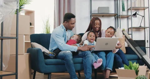 Real estate concept where good-looking cheerful happy modern dark-skinned family Stock Footage 150660127