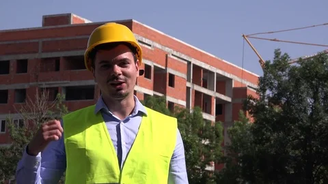 Real estate developer builder talking gesturing presenting construction stage 4K Stock Footage 77189763