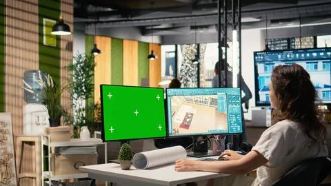 Real estate developer reviews project blueprints with chroma key Stock Photos