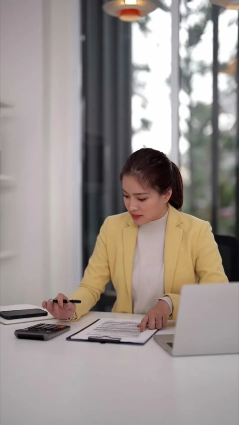 Real estate professional analyzing property market data on laptop computer .. Stock Footage 333469164