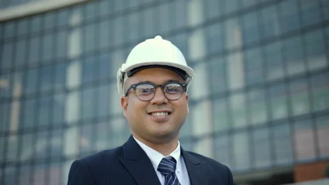 Real estate project manager or architect looking camera in construction site. Stock-Footage 231837495