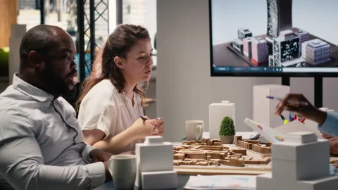 Real estate team using 3D models to explore construction layout options Stock Footage 316643913