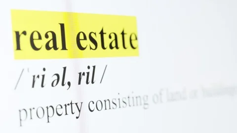 Real Estate Text Macro Shot Highlighted in Yellow Color On Computer Screen Stock Footage 123224424