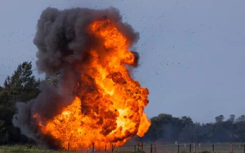 Real explosion with flying debris Stock Photos