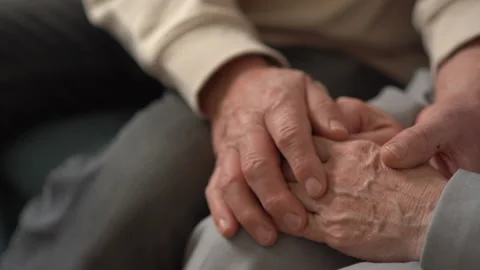 Real feelings. Close up of hands of nice elderly people being held together Stock Footage 169663246