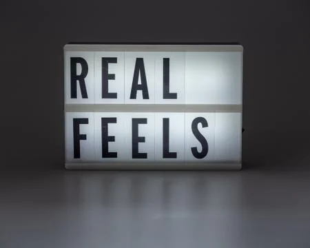 'REAL FEELS' in retro lightbox Stock Photos