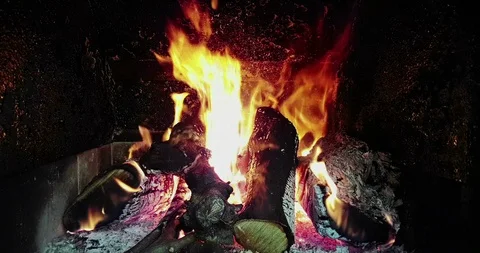 Real fire flames burn movement with branches of wood, fireplace, on black Video stock 91018482