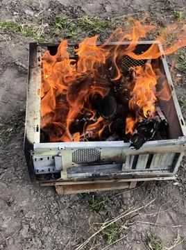 Real fire in the old computer case Stock Photos