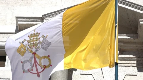Real flag of the Vatican, waving in the wind on a balcony Stock Footage 104535878