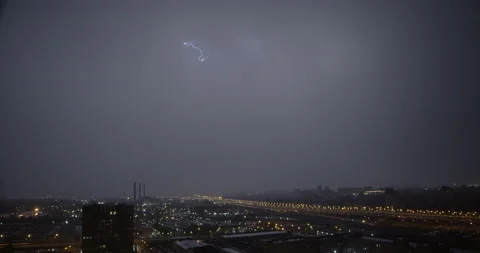 Real flashes of lightning over the city during a powerful night thunderstorm. Stock Footage 154393049