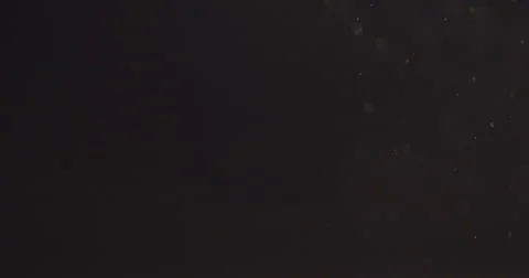 Real floating particles with lens flare over black background Stock Footage 67168889