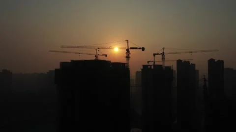 Real Footage of Tower Crane Operating at Construction Site Stock Footage 319610689