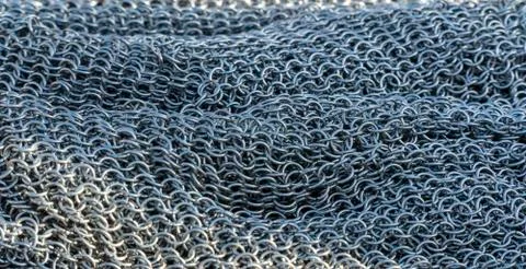 Real handmade chainmail texture close up. Background from metal rings Stock Photos