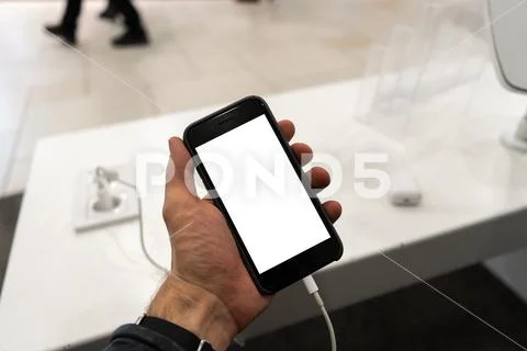 Real life use of phone in a men's hand holding with free copy space for your ad Stock Photos