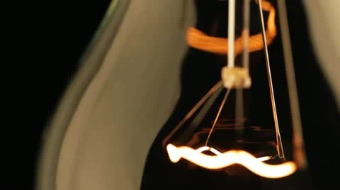 Real light bulb turning on, back lit, close-up Stock Footage 21358067